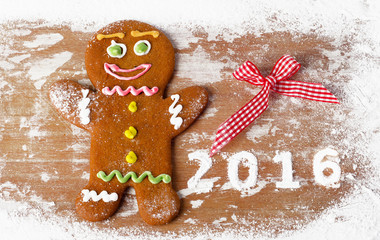 Gingerbread man on a wooden table.