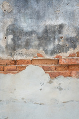 Aged concrete wall with old bricks background