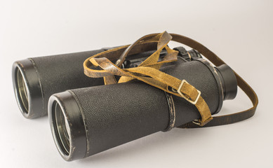 Old vintage binoculars. Isolated on white background.