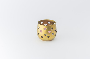 Golden candle holder. Hearths shapes.