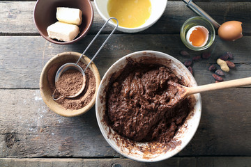 Preparing dough for chocolate pie on table close up