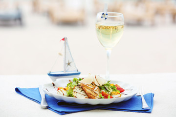 Tasty salad on white served table