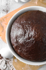 Cooked chocolate pie in a baking tray on a table, top view