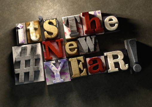 It's The New Year! A Title Celebrating 2016 On Wooden Ink Splattered Printing Blocks. Grungy Typography On A Concrete Background. New Year And The Festive Season On 1 January.