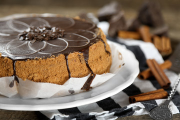 Tasty chocolate cake on wooden background