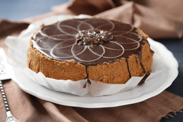 Tasty chocolate cake on wooden background