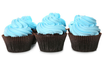Delicious cupcakes isolated on white background
