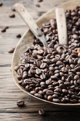 Raw coffee beans on the wooden table
