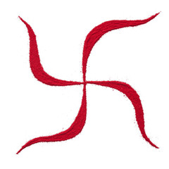 Top view close up of red color swastik rangoli symbol isolated on white background. © Prashant ZI