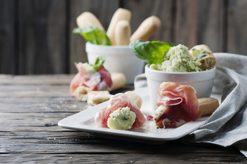 Italian grissini with cream cheese and prosciutto