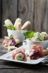Italian grissini with cream cheese and prosciutto