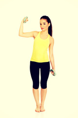 Naklejka premium Active woman holding weights.