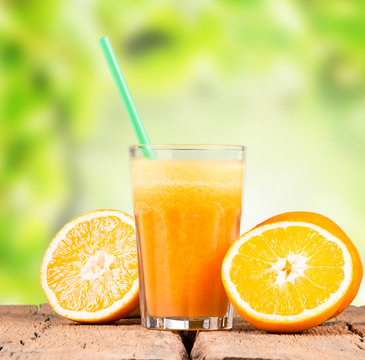 Fresh orange juice on woden table 