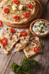 Indian paratha stuffed with potatoes and sauce. Vertical
