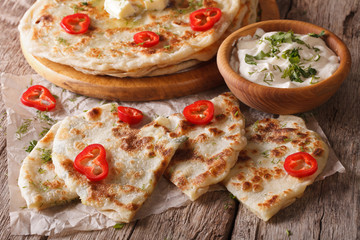 Indian paratha stuffed with potatoes and sauce. horizontal
