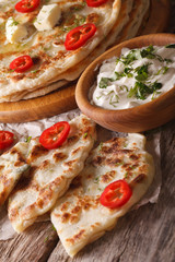 hot paratha stuffed with potato and herbs closeup. vertical
