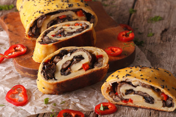 Roll with forest mushrooms and pepper close-up. horizontal
