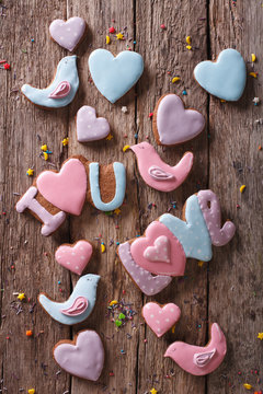 background of love gingerbread cookies. vertical top view
