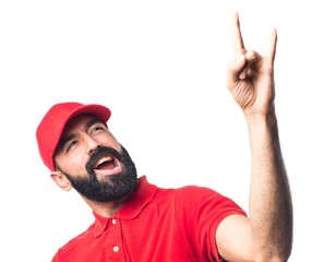 Naklejka premium Pizza delivery man making horn gesture