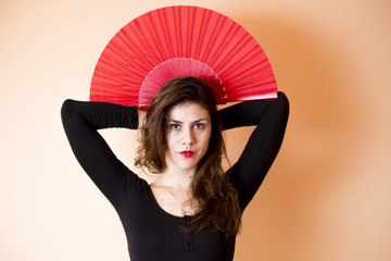 Girl posing with red fan