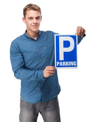 young man showing a parking sign