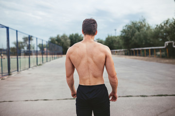 Man showing sports figure