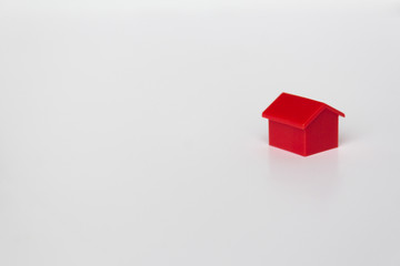 red  house miniature - toy house on white background