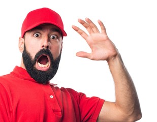 Pizza delivery man doing surprise gesture