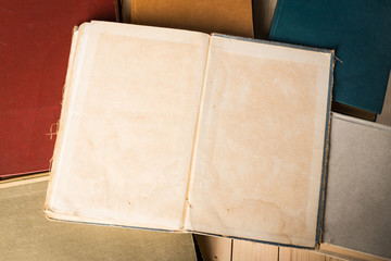 A stack of books on wooden table