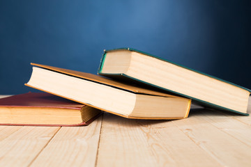 A stack of books on wooden table