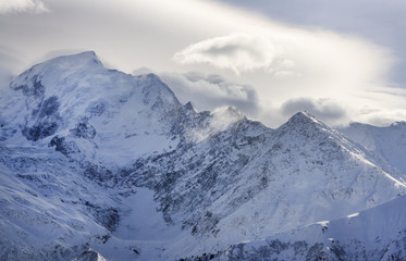 Mountain ridge covered by clouds
