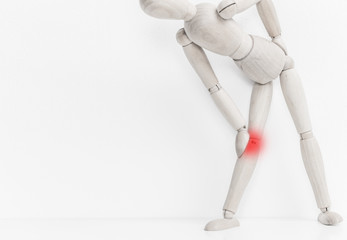 Wooden man expressing pain