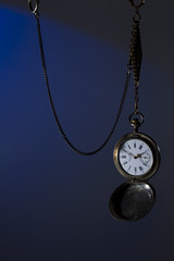 Antique silver pocket watch on a chain