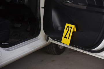 evidence number tag in vehicle at crime scene
