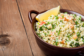 Turkish traditional meal - Taboulé Salad on a wooden table made