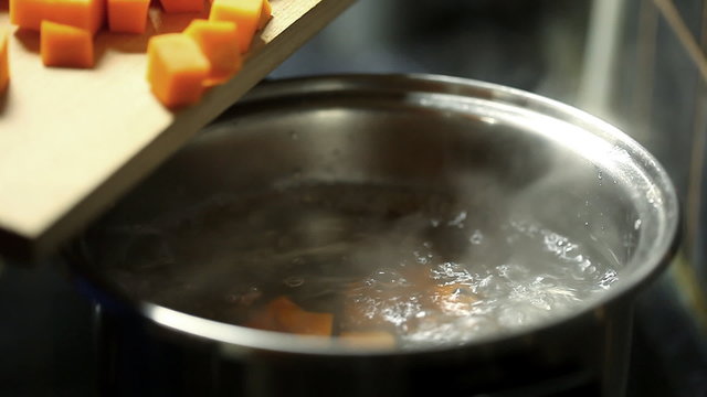 sliced ​​pumpkin cubes in boiling water
