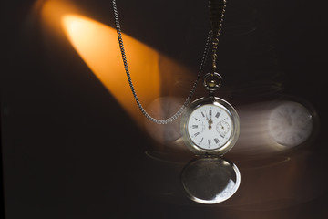 Antique silver pocket watch on a chain