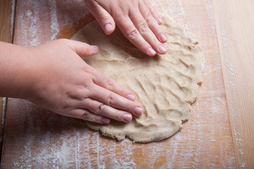 Woman's hands in process of preparing of dough for gingerbread c