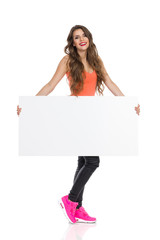 Young Casual Woman Holding Banner