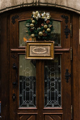 stylish luxury christmas wreath on vintage door, celebration dec