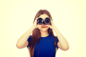 Young woman with binoculars.