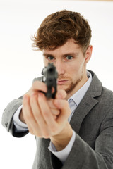 Closeup of a young man with a gun