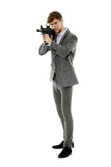 Young man using machine gun