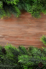 Christmas fir tree branches on wooden table