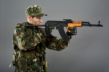 Soldier with machine gun aiming