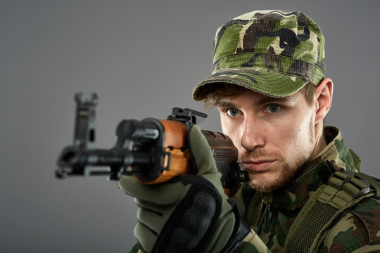 Soldier with machine gun aiming