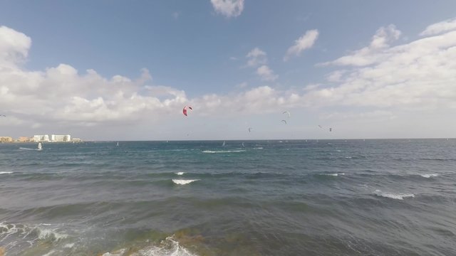 surfer beach with many kite and wind surfers