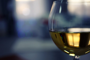 Glass of wine on blurred background