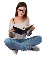 young woman reading a book sitting on the floor