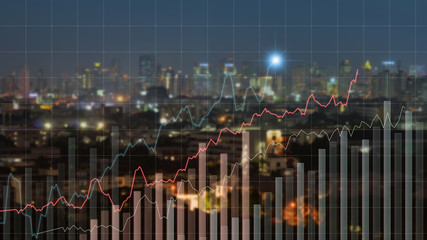Fototapeta na wymiar visual business graph on screen with night city background